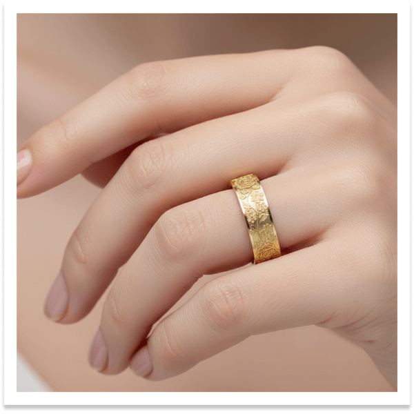 Hand wearing gold ring